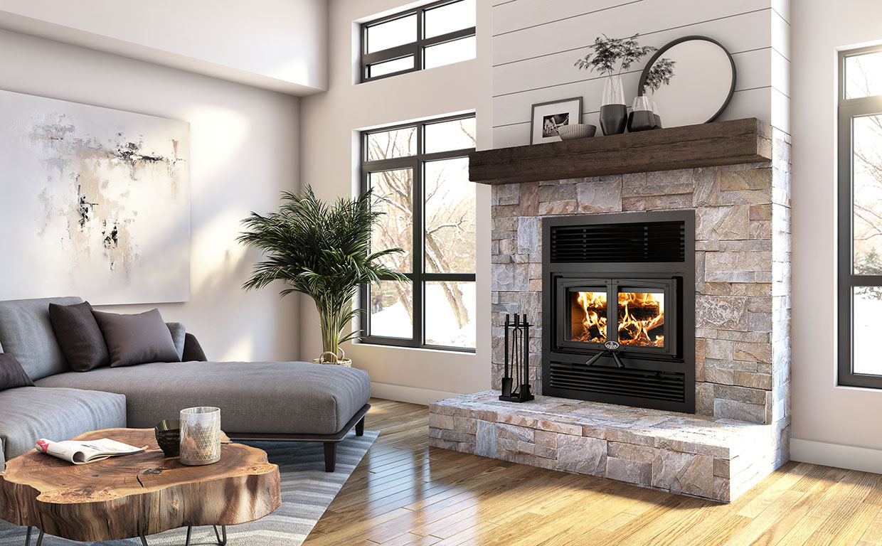A brick chimney with a metal cap sits on a pitched roof covered in snow - Contact us.