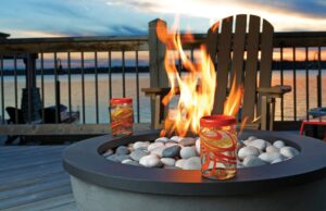 Certifications and training chimney Repair Stainless steel gas fire pit with a black fire ring on a wooden deck.