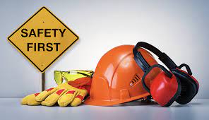 Certifications and training chimney Repair Safety equipment including a hard hat, ear muffs, gloves, and a sign reading "Safety First"