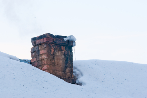 Damaged chimney crown before repair by Midwest Chimney Repair