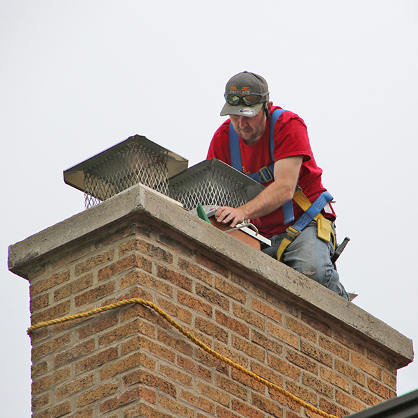 Damaged chimney crown before repair by Midwest Chimney Repair