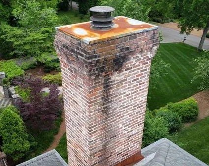 Damaged chimney crown before repair by Midwest Chimney Repair