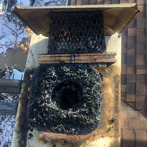 Damaged chimney crown before repair by Midwest Chimney Repair