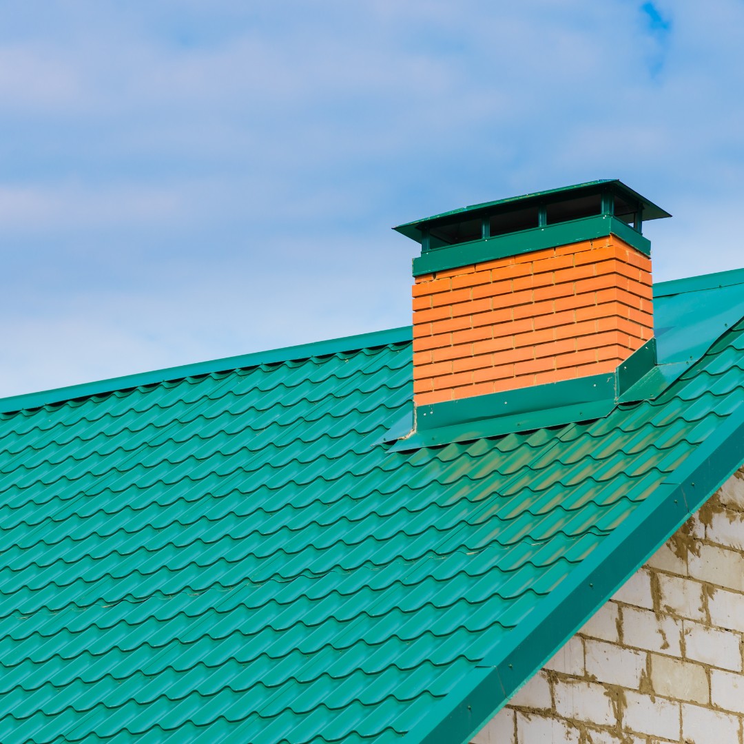 A brick chimney damaged by the freeze-thaw cycle, showing cracks and spalling brickwork. This emphasizes the impact of harsh Minnesota winters on masonry structures.